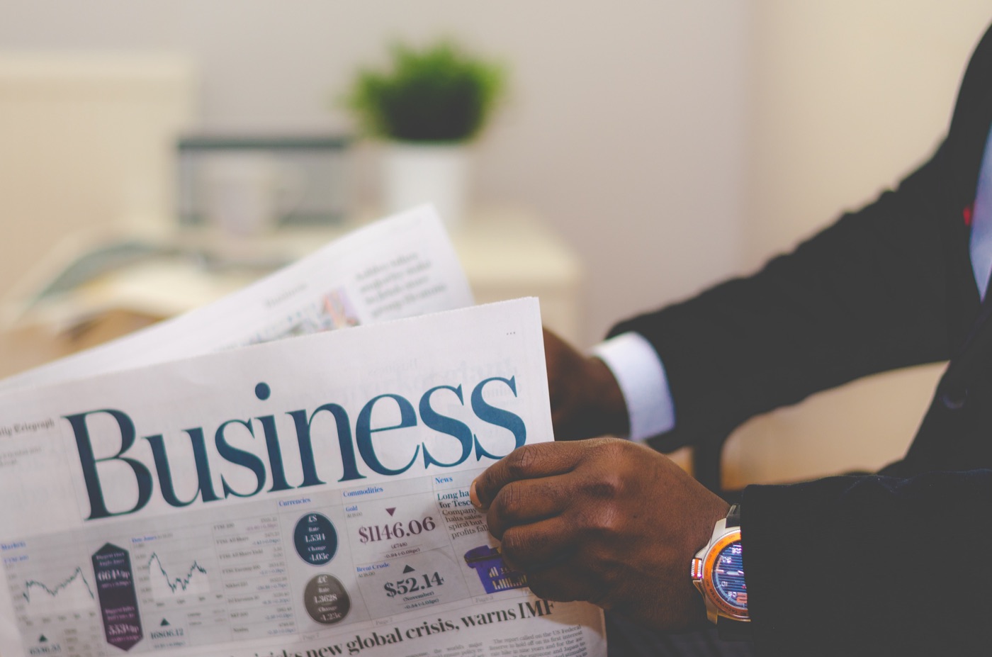 Business professional reviewing financial news